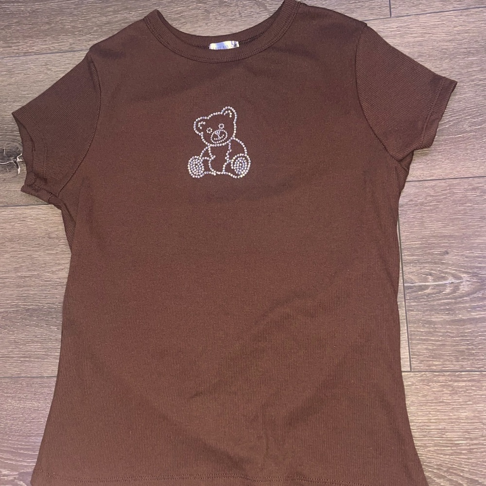 Brown teddy bear t shirt size says xL but it’s more like a S-M